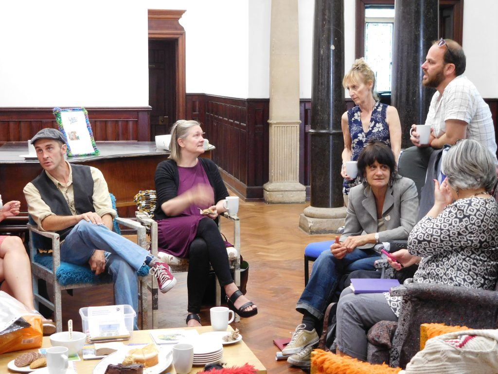 People chatting, drinking coffee