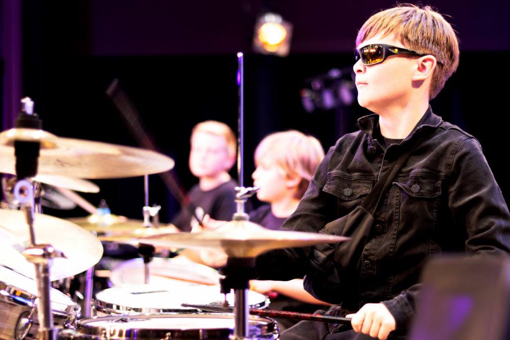 Child playing drums
